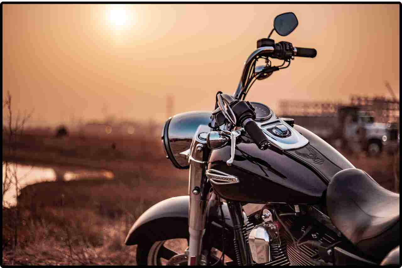 Classic black cruiser motorcycle gleaming in the sunlight.